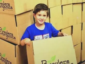 Boy holding brewers box